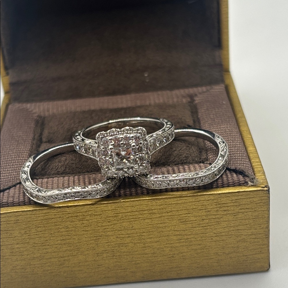 Neil Lane Diamond Ring all 3 are size 7
 1- 3/8 ct 14K WG & 14K diamond Bands